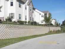 Block retaining wall installation at the Condos