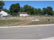 Boulder retaining wall system