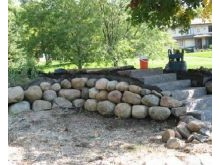 Boulder wall with stone steps