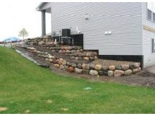 Tiered step boulder walls