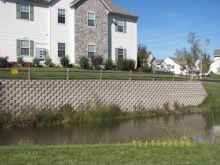 Block retaining wall installation at the Condos