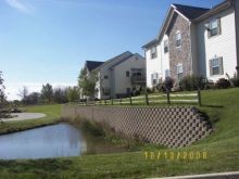 Block retaining wall installation at the Condos