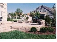 Multi level brick patio, and plantings in Lake Barrington